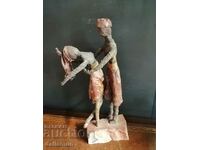 old statuette on stone 40 cm