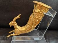 A gilded rhyton spear