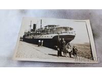 Ska Varna Man woman boy and girl in front of a steamer at the wharf