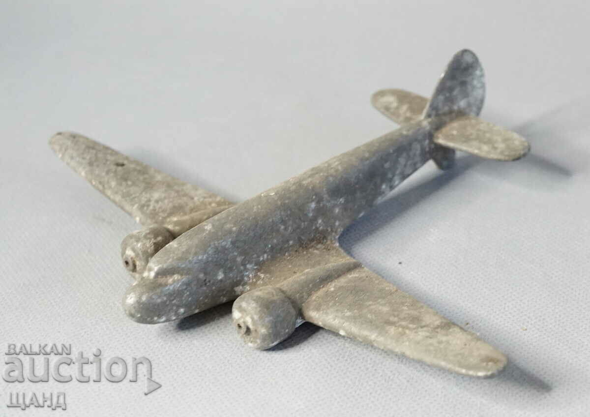 Old metal toy model airplane