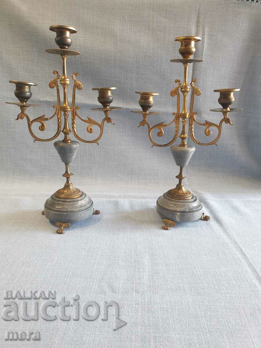 A pair of aristocratic marble and bronze candlesticks