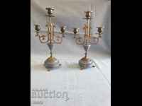 A pair of aristocratic marble and bronze candlesticks