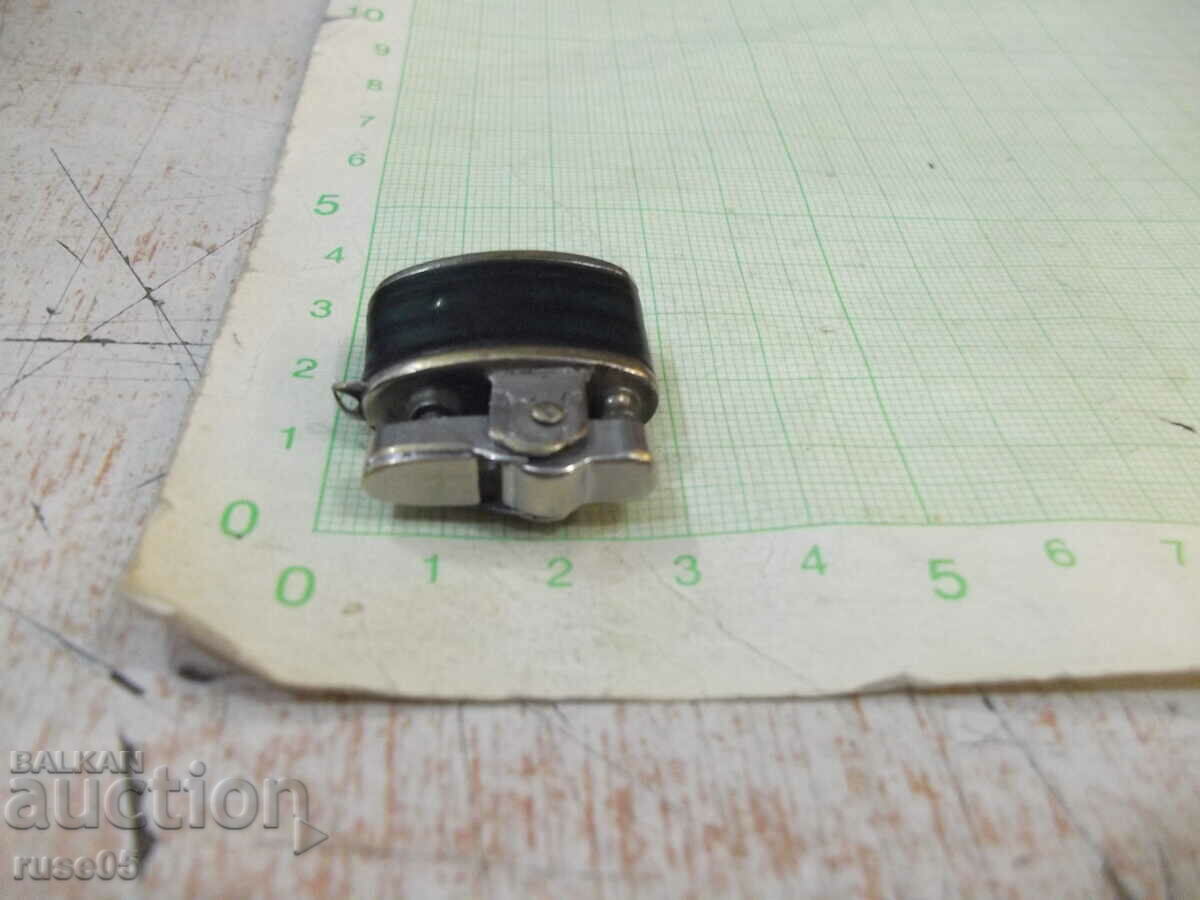 Auction A small petrol lighter Auction A small petrol lighter