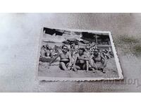 Photo Three men on the beach