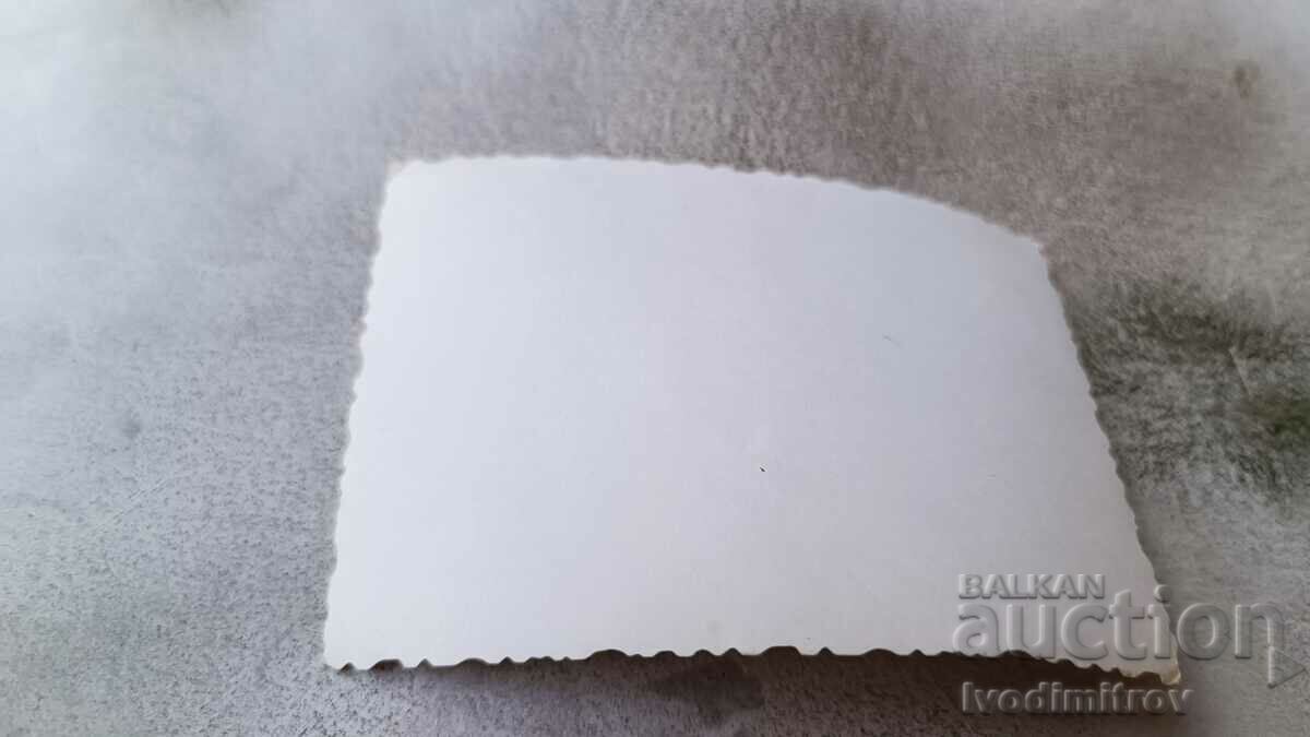 Photo Two men, a woman and a boy on the beach with price 1.45 BGN | € 0.74