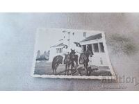 Photo Two young girls riding black horses