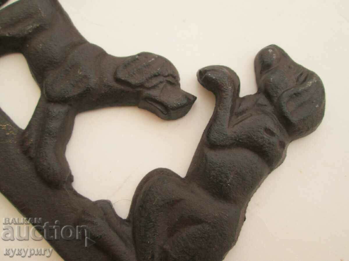 Delivery of Old metal cast iron wall hanger with cast iron dogs Delivery of Old metal cast iron wall hanger with cast iron dogs
