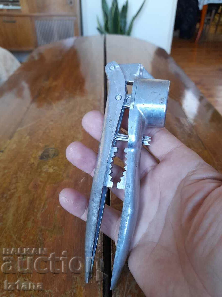 Auction Old aluminum garlic press Auction Old aluminum garlic press
