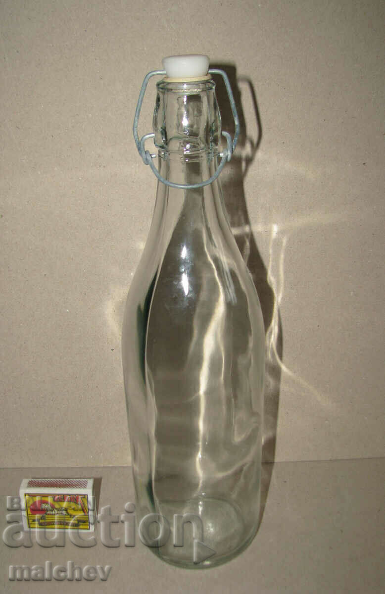 Glass bottle 1 l with built-in porcelain stopper.