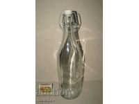 Glass bottle 1 l with built-in porcelain stopper.