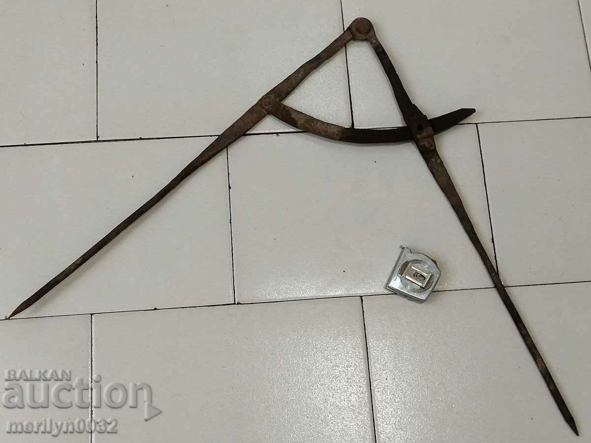 Old blacksmith's compass, ruler, primitive tool