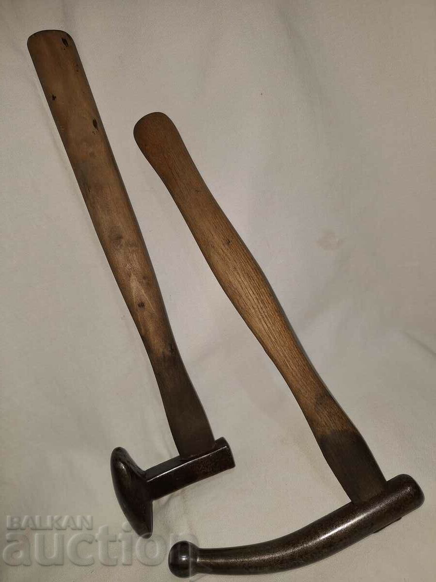 Two old tin hammers