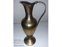 A MASSIVE JUG. BRASS