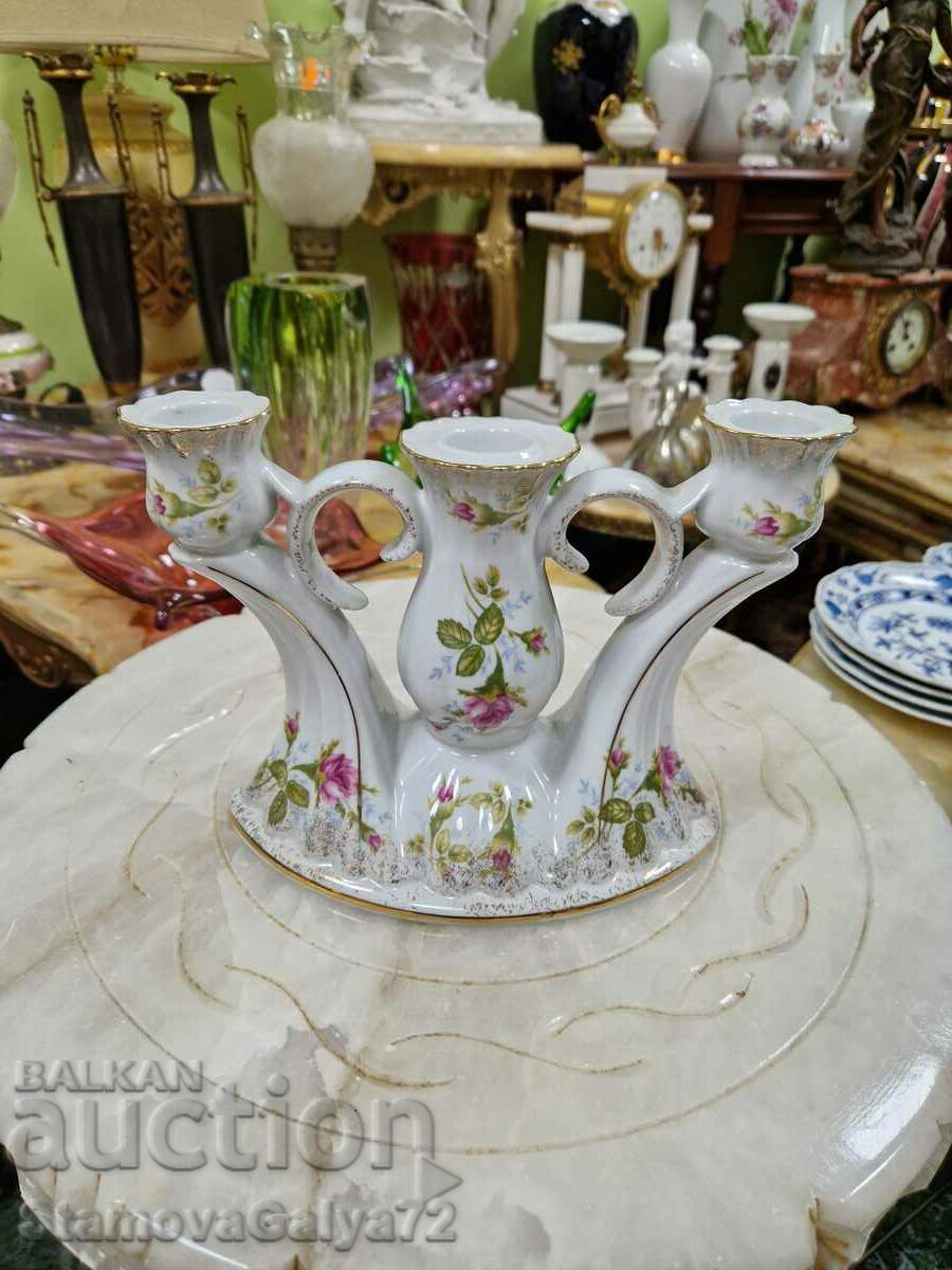 A lovely antique porcelain candle holder trio