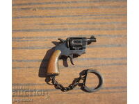 an old key chain gun with soca holsters