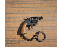 an old key chain gun with soca holsters