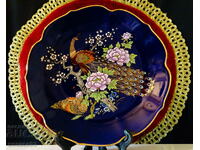 Wall plate, gold, cobalt, peacocks, flowers.