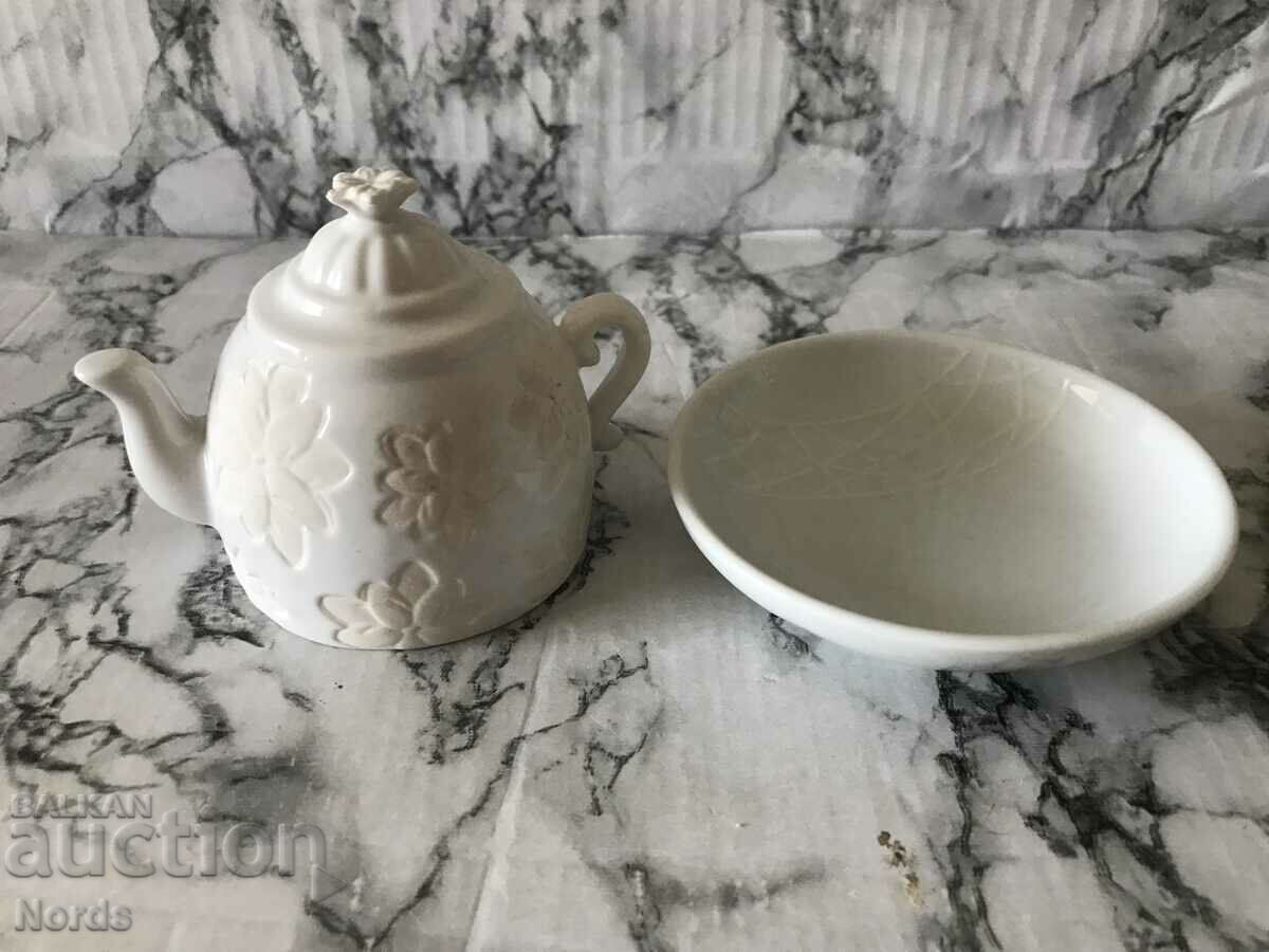 Small teapot for decoration and saucer