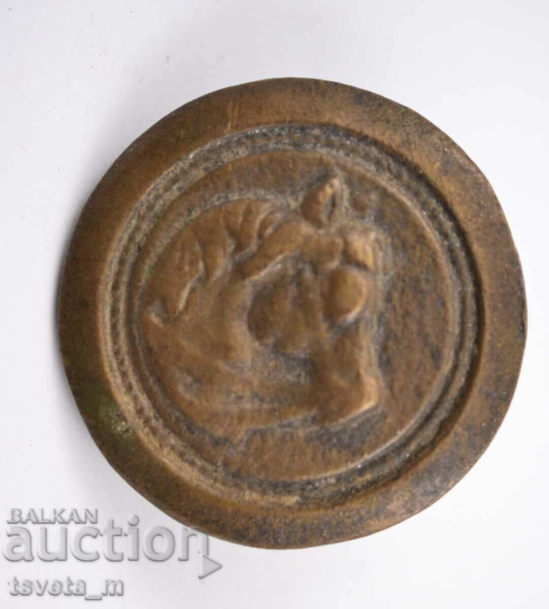 Part of a horse's bridle, buckle with a horse's head, bronze Part of a horse's bridle, buckle with a horse's head, bronze