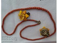 Old red coral necklace and amber earrings