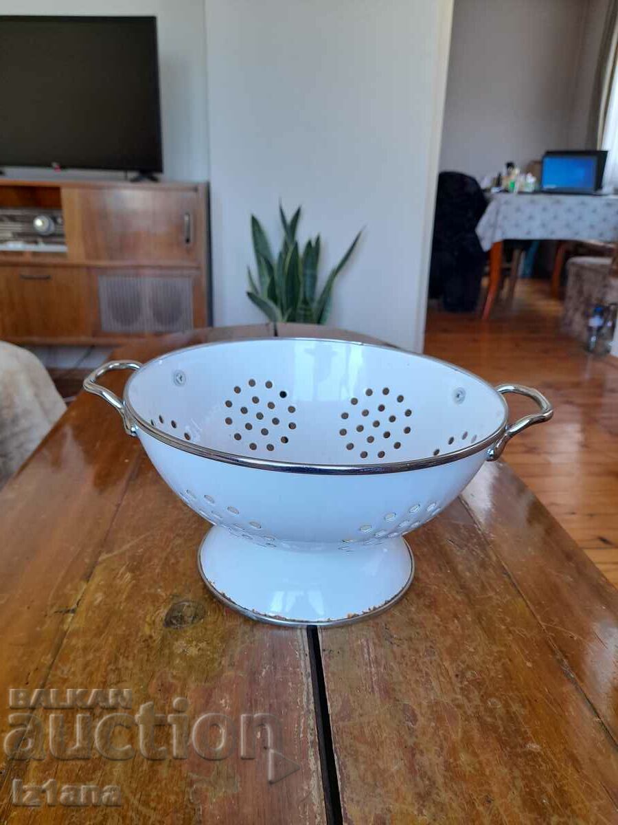 Old enameled strainer, colander