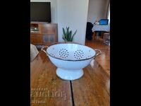 Old enameled strainer, colander