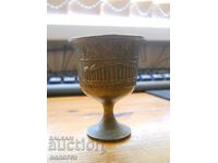 A bronze cup with an image of the Acropolis