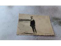 Photo Woman in vintage swimsuit on the beach