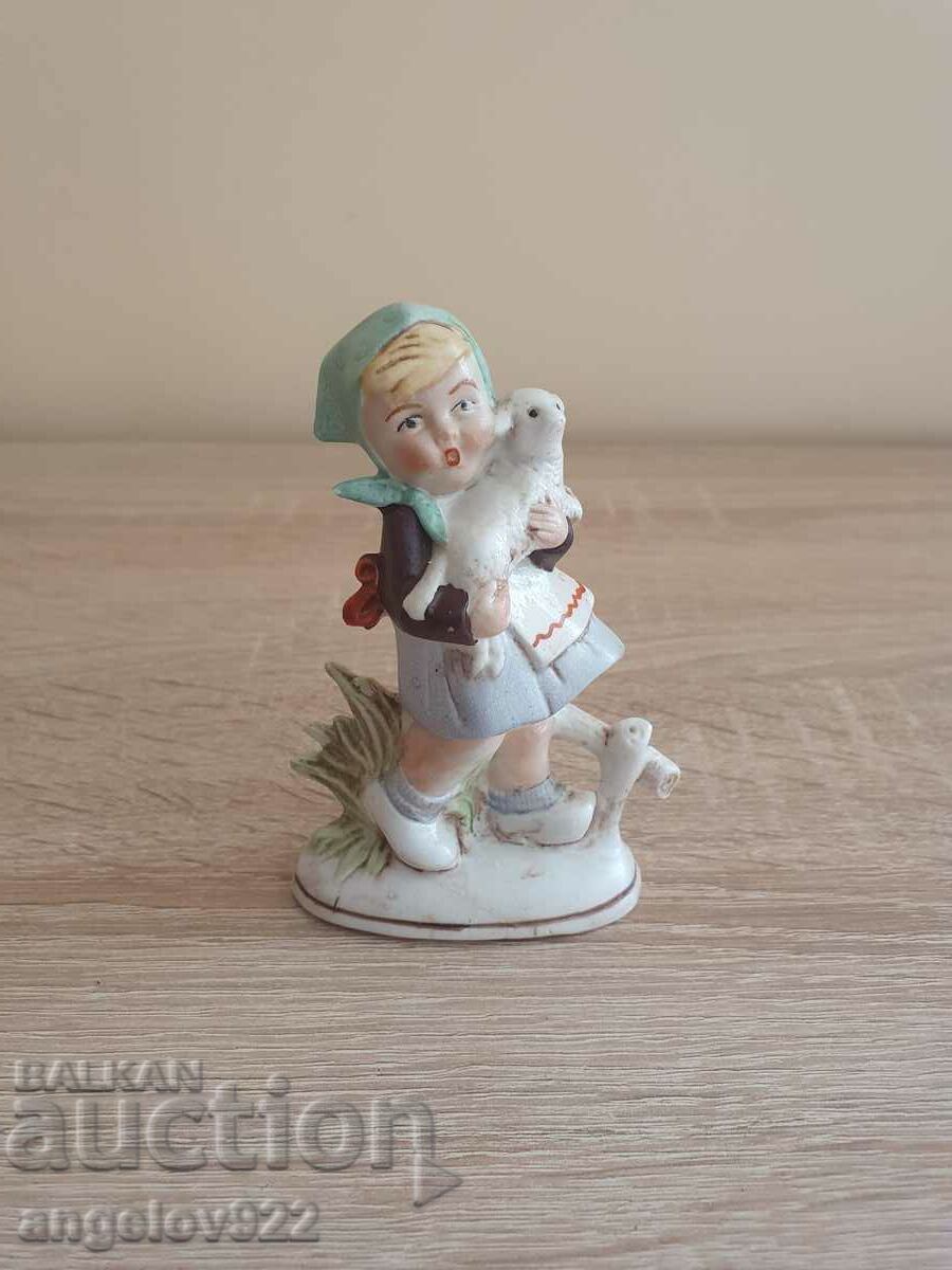 Old porcelain figurine figurine