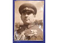 A large photo of General Ivan Marinov.