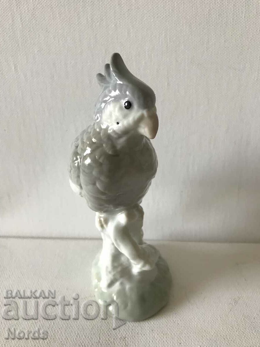 A beautiful porcelain figurine of a parrot