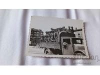 Photo Officers and soldiers on a vintage military truck