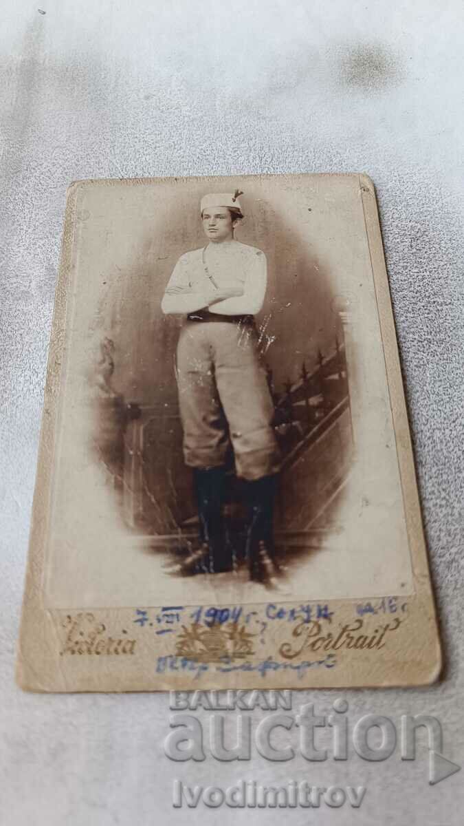 Photo Young man in youth uniform Column 1904 Carton