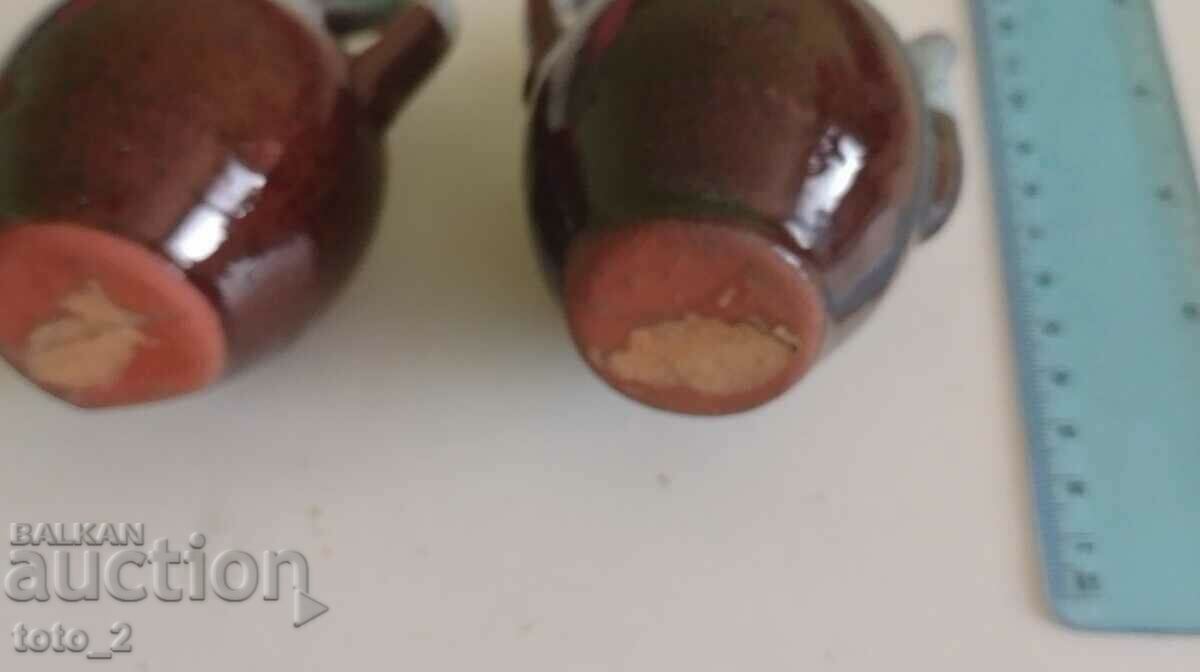 Auction PAIR OF CERAMIC JUGS Auction PAIR OF CERAMIC JUGS