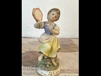 A beautiful biscuit porcelain figure