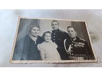 Photo Officer with orders and medals with his family 1939