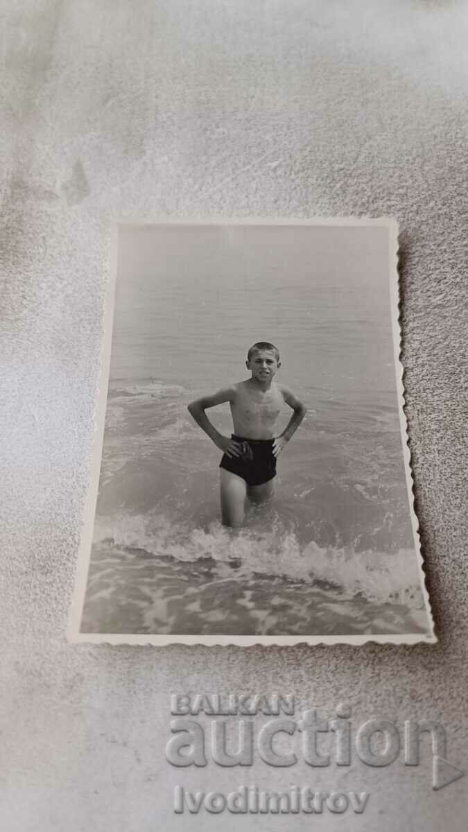 Photo Boy in retro swimsuit on the beach