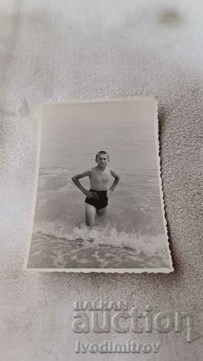 Photo Boy in retro swimsuit on the beach