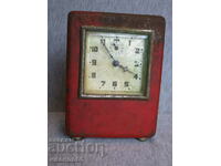 old alarm clock with money box