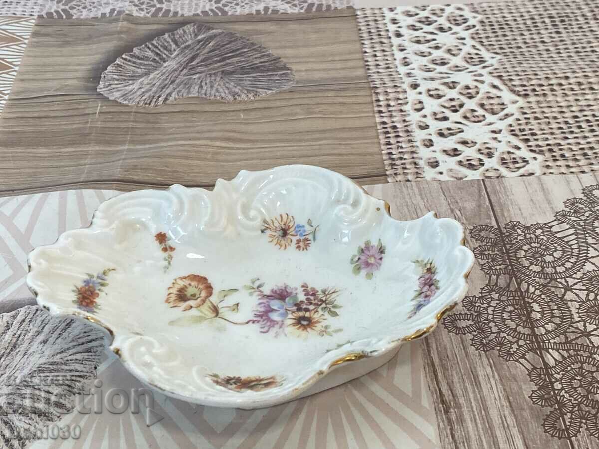 A beautiful porcelain saucer with markings