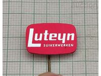 LUTEYN FOOD ADVERTISING BADGE .