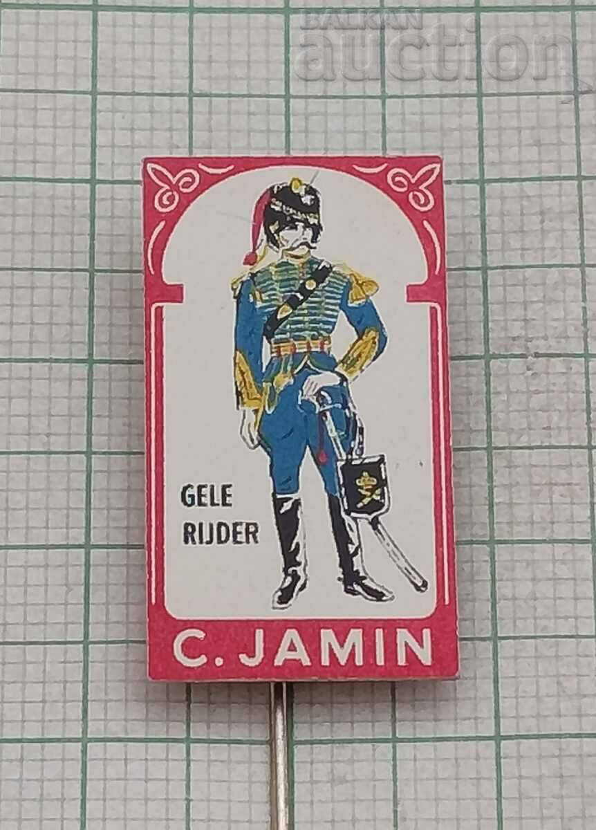 C. JAMIN HUSSAR IN UNIFORM ADVERTISING BADGE