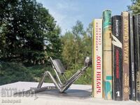 Corner for books in the style of scrap metal art.