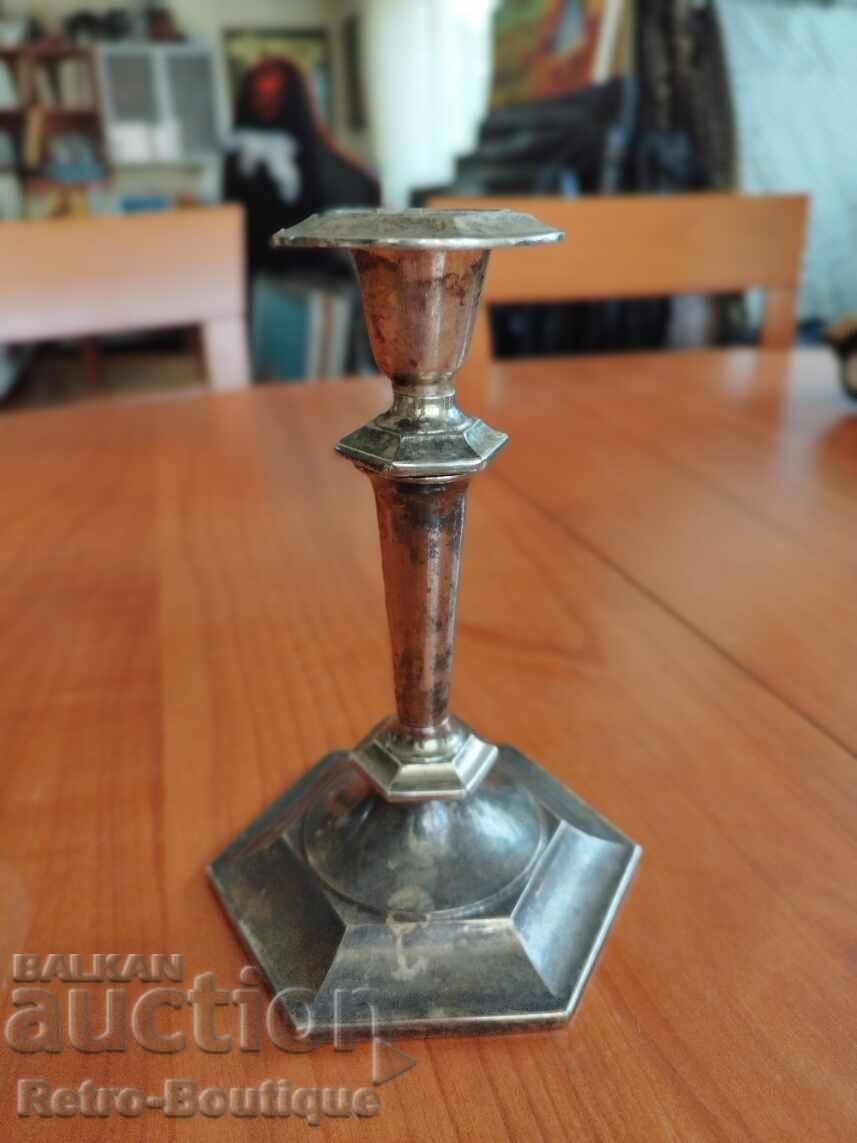 Old metal candlestick, height 18 cm.