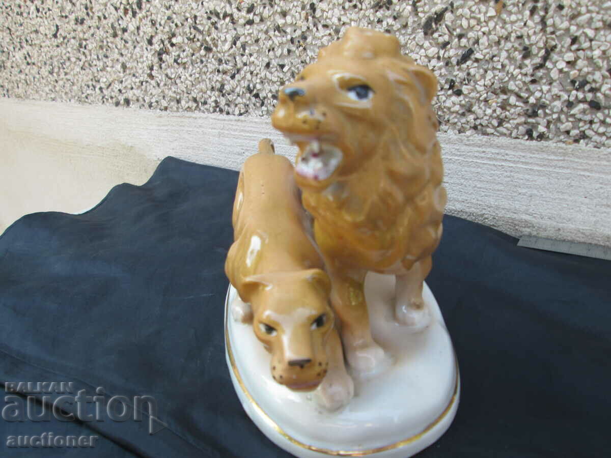 Auction OLD PORCELAIN FIGURE LION AND LIONESS Auction OLD PORCELAIN FIGURE LION AND LIONESS