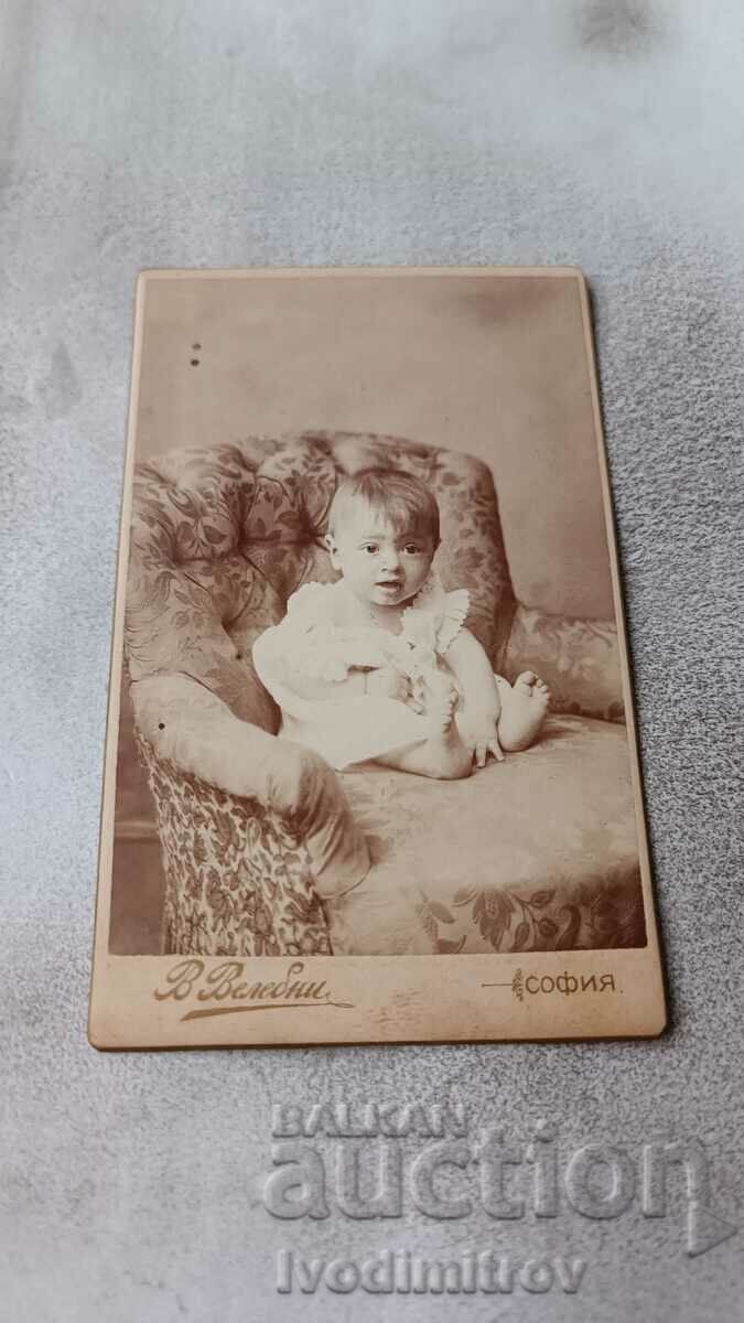 Photo Little girl on an armchair Cardboard