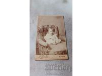 Photo Little girl on an armchair Cardboard