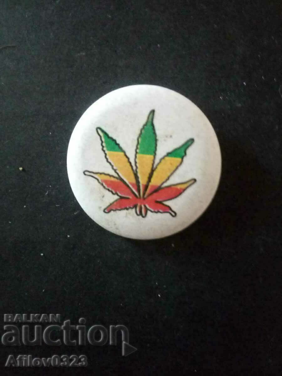 Plant leaf badge.