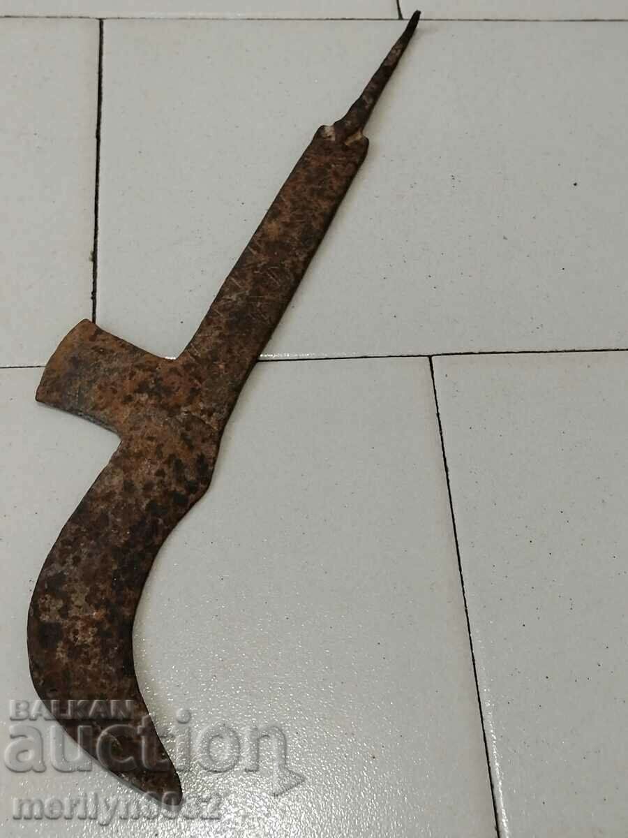 Old wrought iron scythe blade