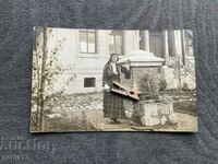 Old photo of a fountain girl wearing ethnography